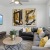 a living room with a couch and a table and tv