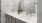 a bathroom with a large mirror and twin sinks