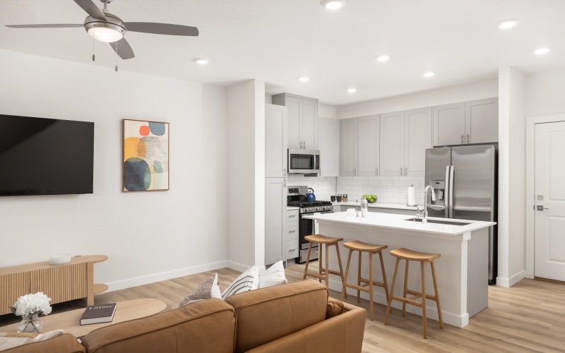 Three bedroom townhome with kitchen island and built-in TV wall in living room