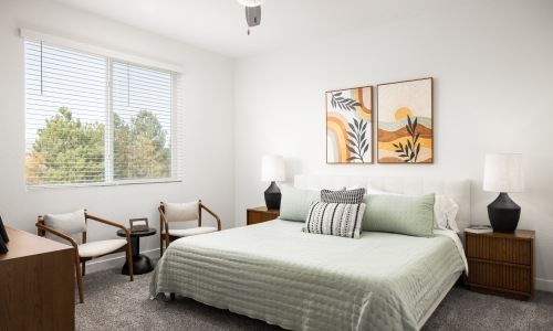 Luxury bedroom with large windows at  The Selby apartments in Colorado Springs