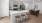 a kitchen island with a table and chairs and dining table beyond